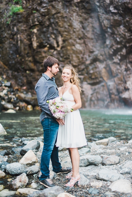 Couple at a waterfall engagement session