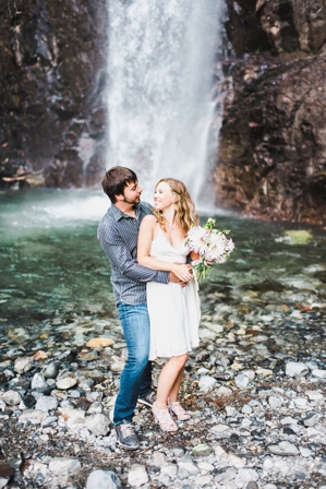 Couple at a waterfall engagement session