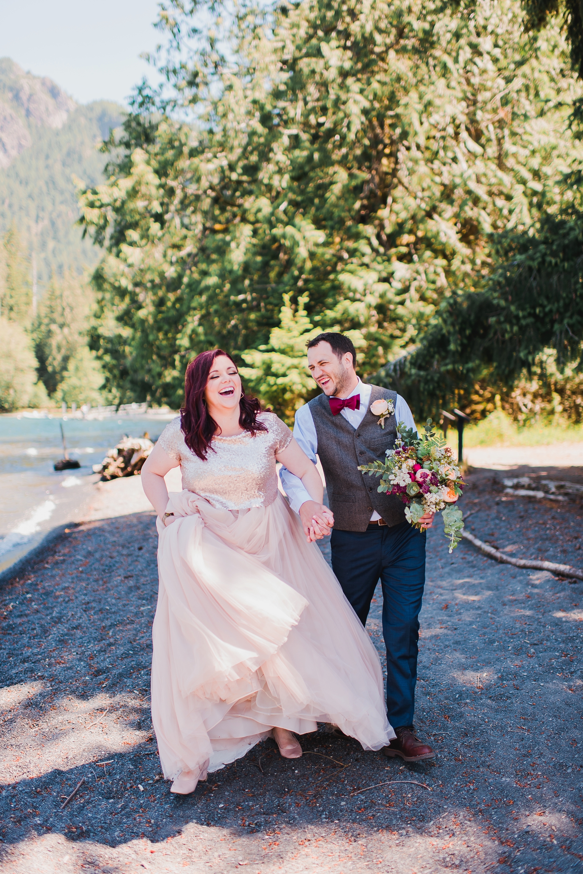 Lake Crescent bride and groom lauging