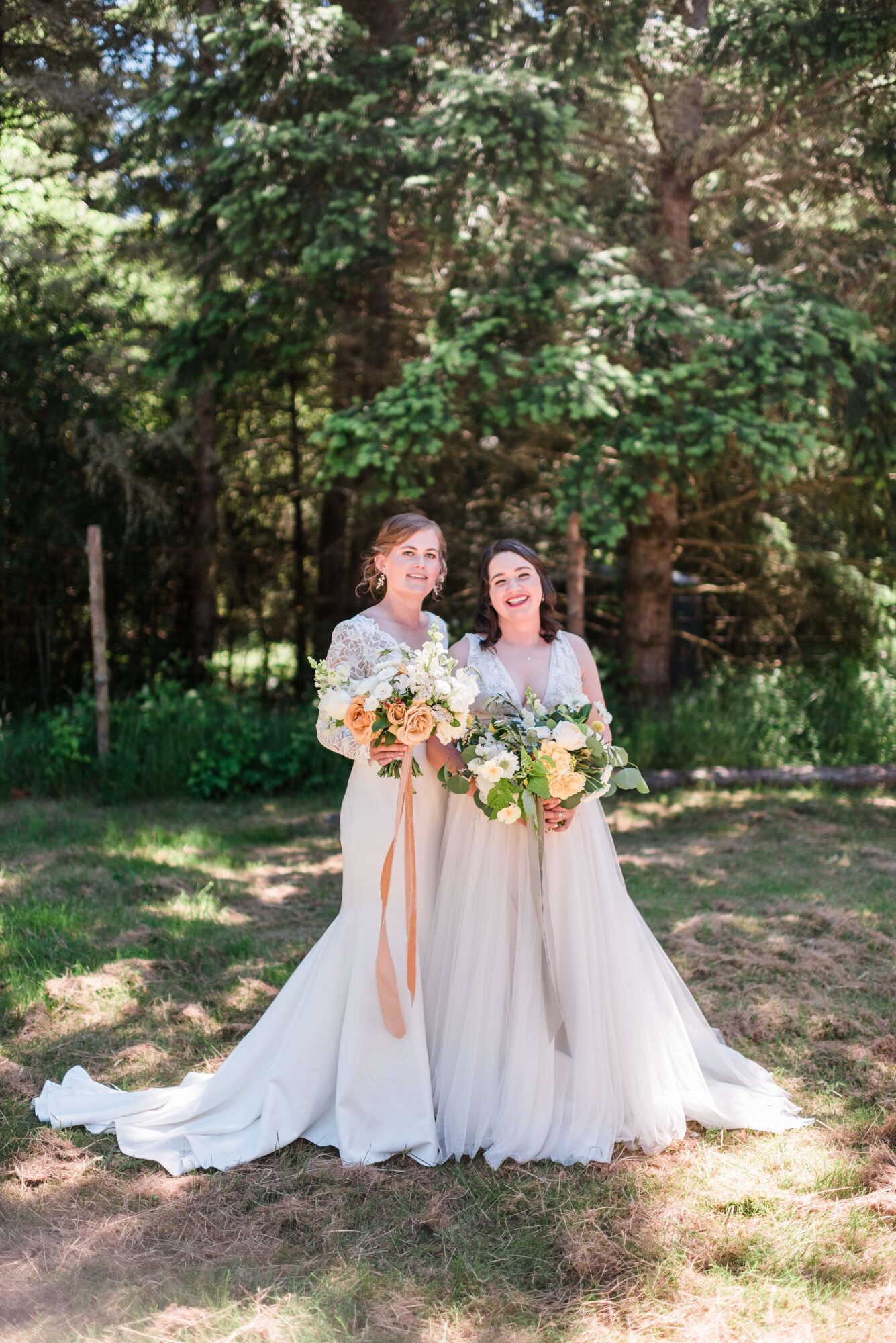 Two brides in the garden at their LGTBQ+ wedding at Saltwater farm on San Juan Island