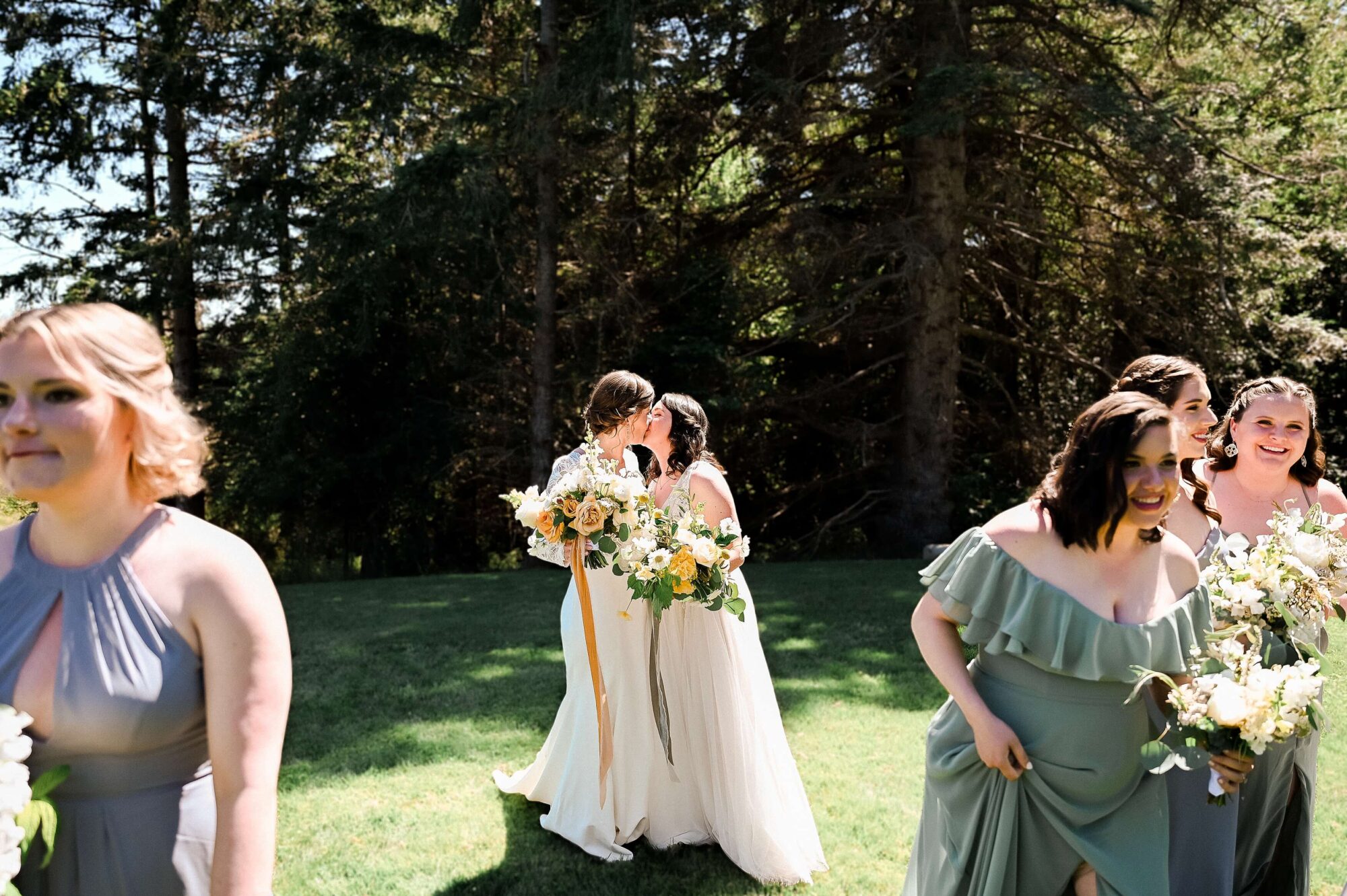 Two LGTBQ+ Brides kissing at Saltwater Farm on San Juan Island