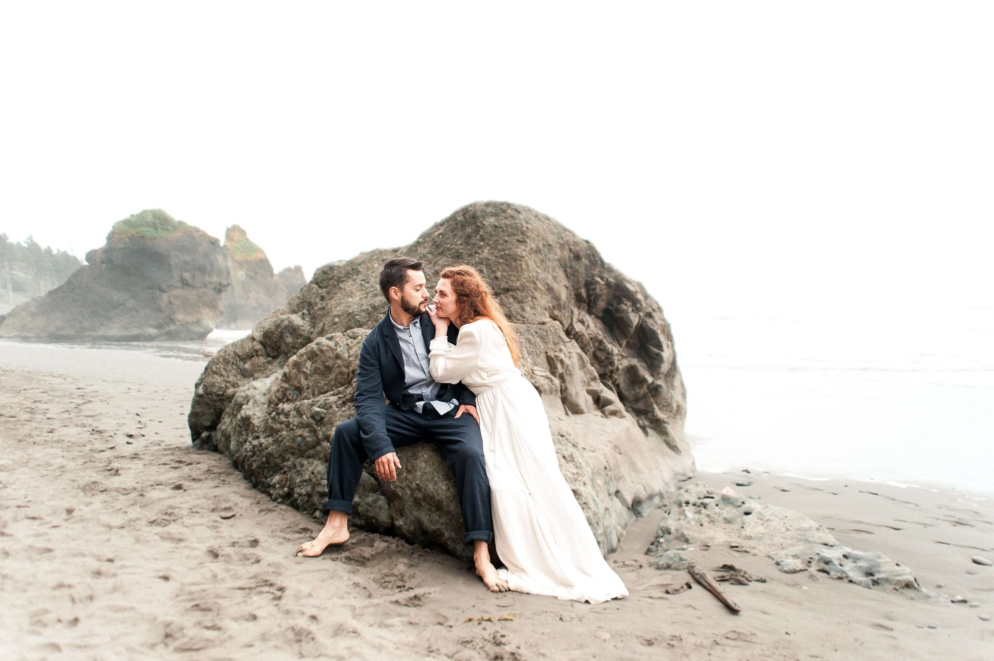 bride and groom nuzzling on the beach at their Seabrook wedding