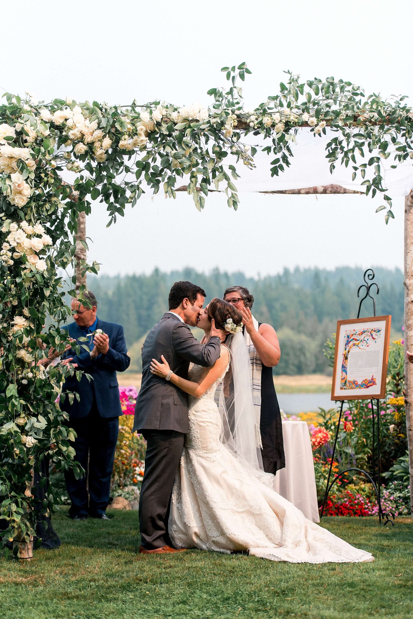 bride and groom share first kiss under the altar at their Whidbey Island Wedding