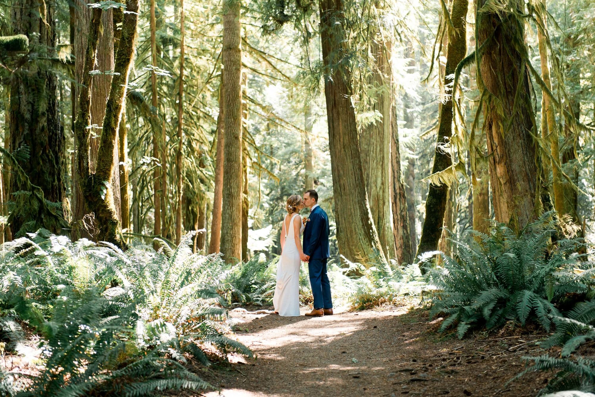 Bride and Groom at Ceremony area at Fern Acres Forks Forest Wedding Venue