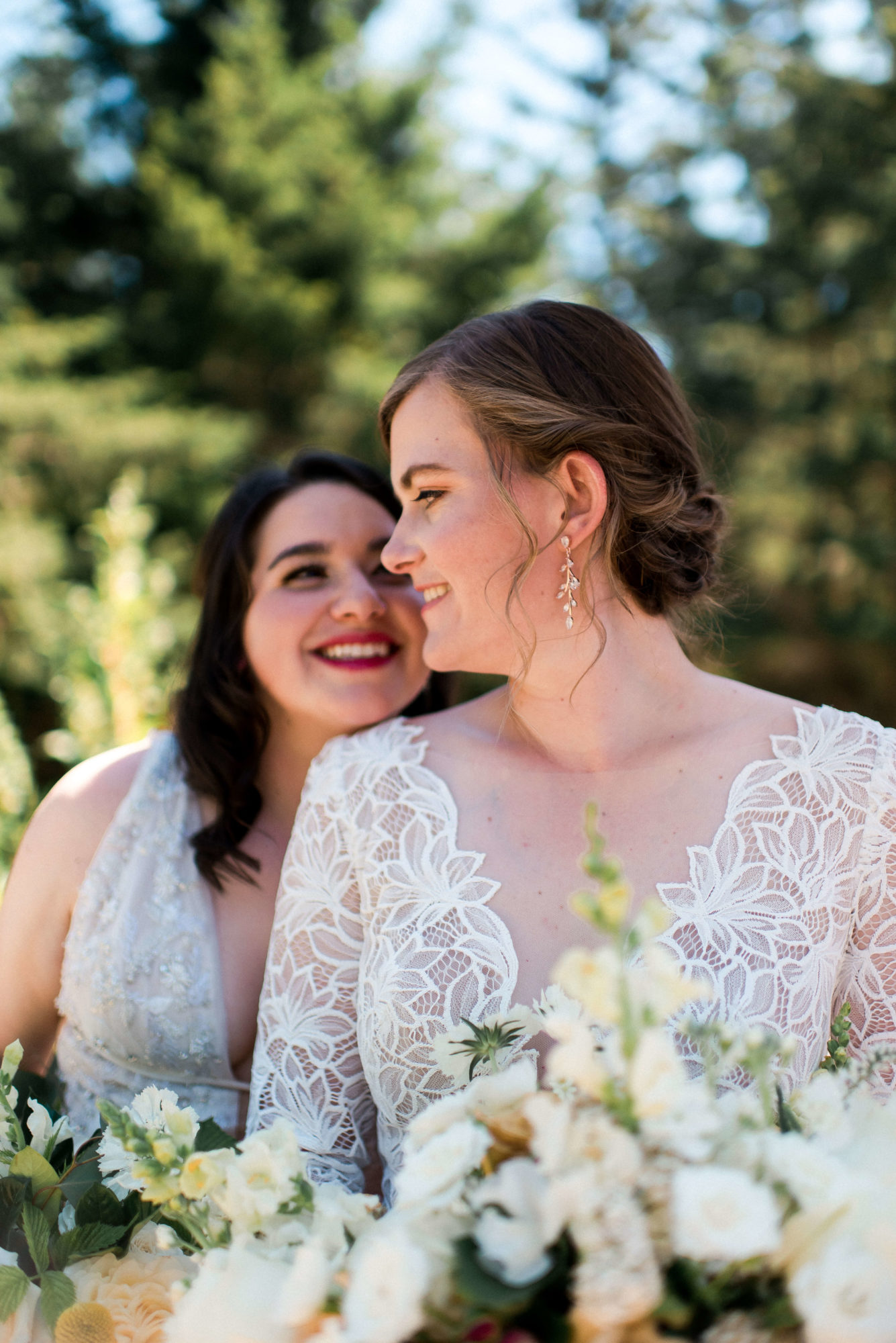 LGTBQ+ brides in a garden at a Kitsap County wedding