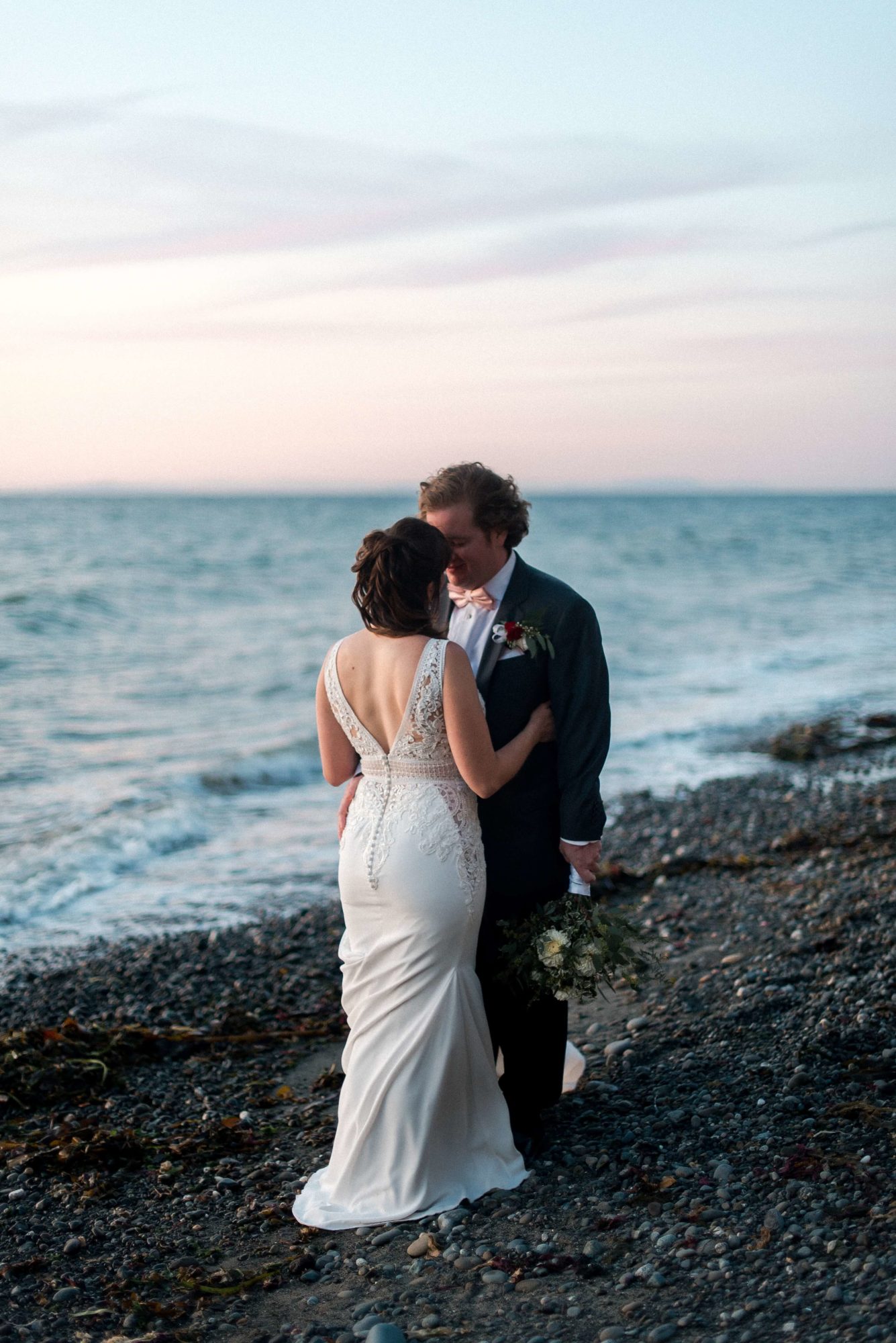 Bride and groom on the beach at sunset in Port Townsend