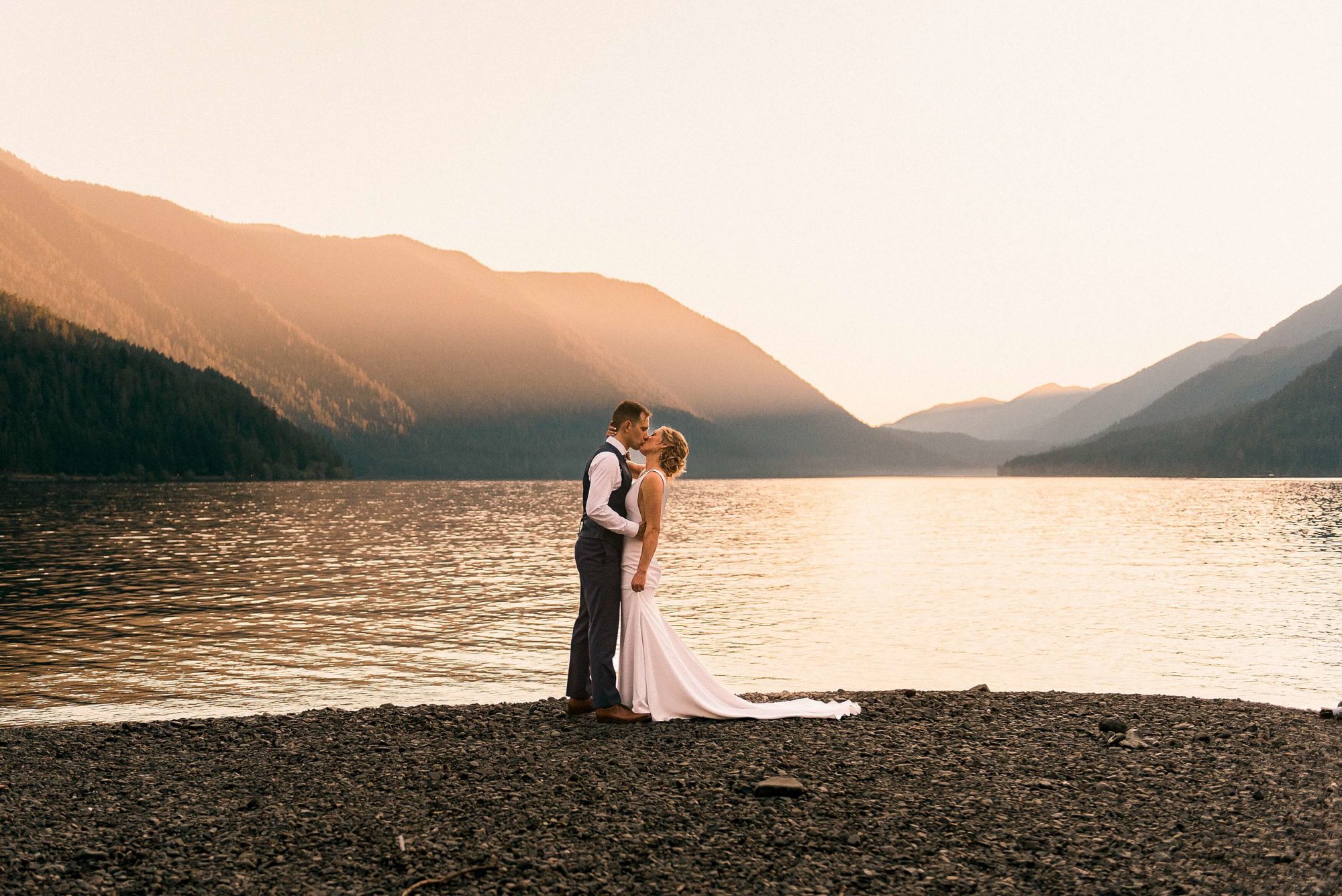 Bride and groom on the beach at their Lake Crescent wedding
