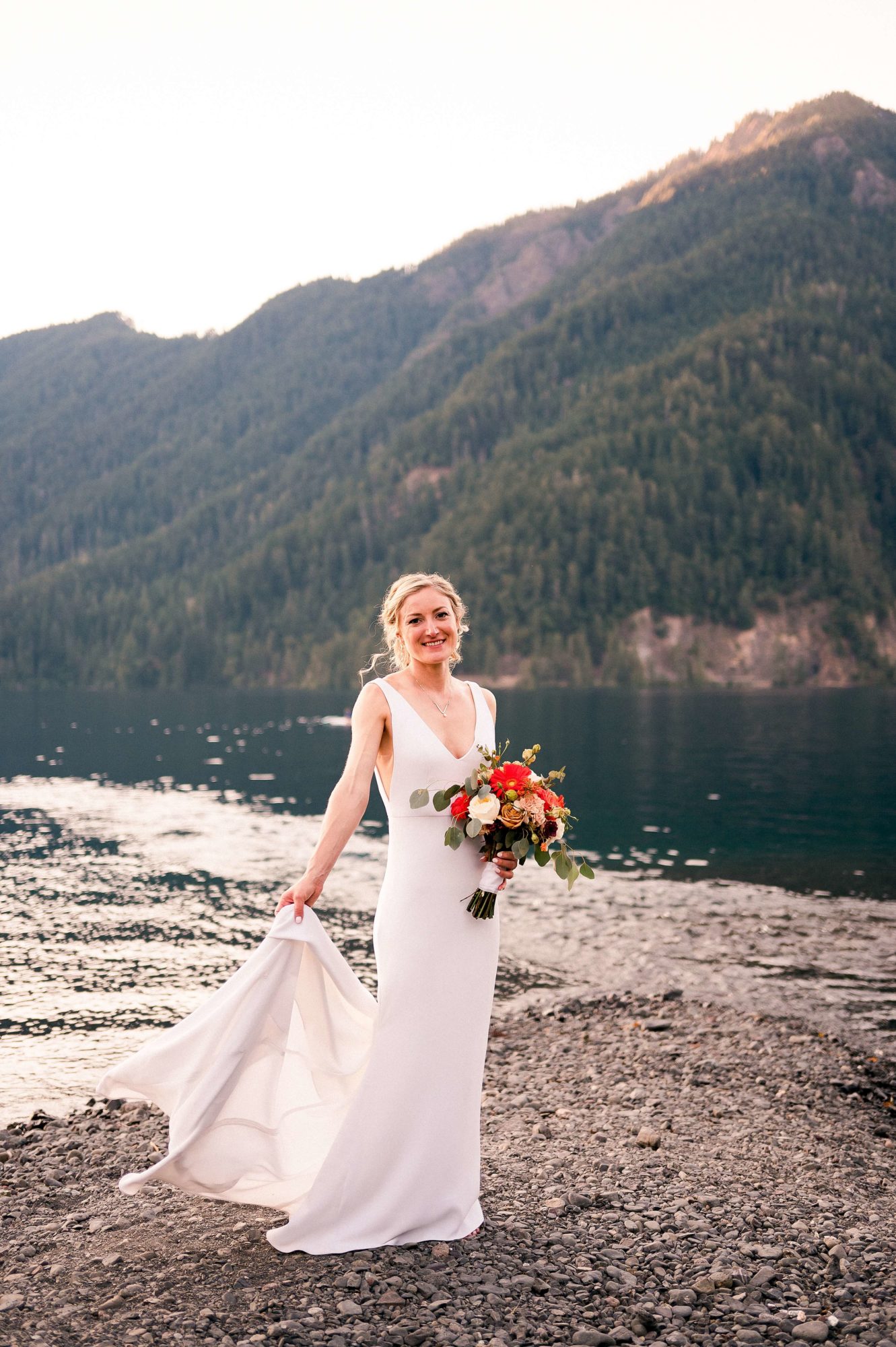 Bride on the beach at Lake Crescent wedding