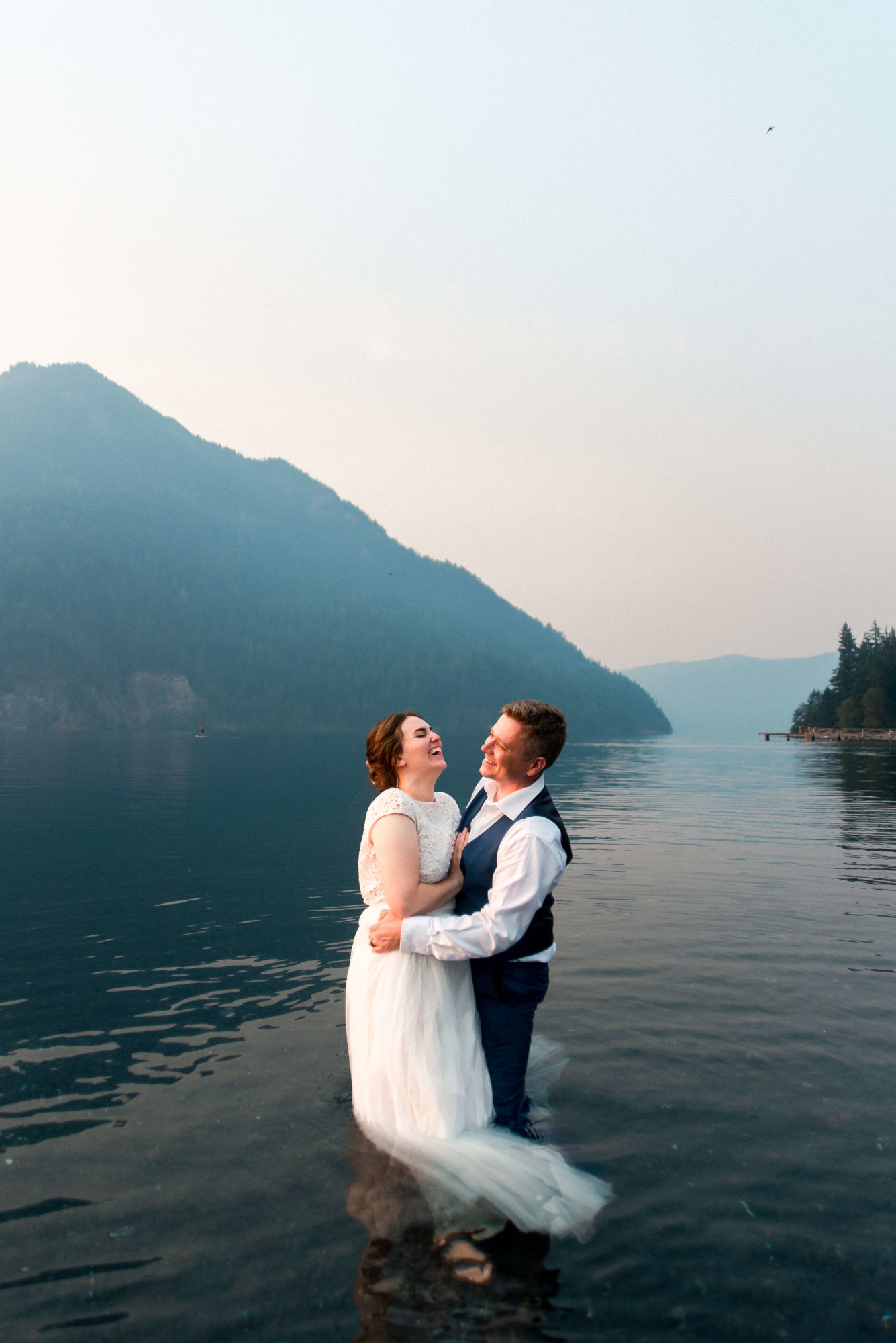 Bride and Groom in the water at Lake Crescent elopement