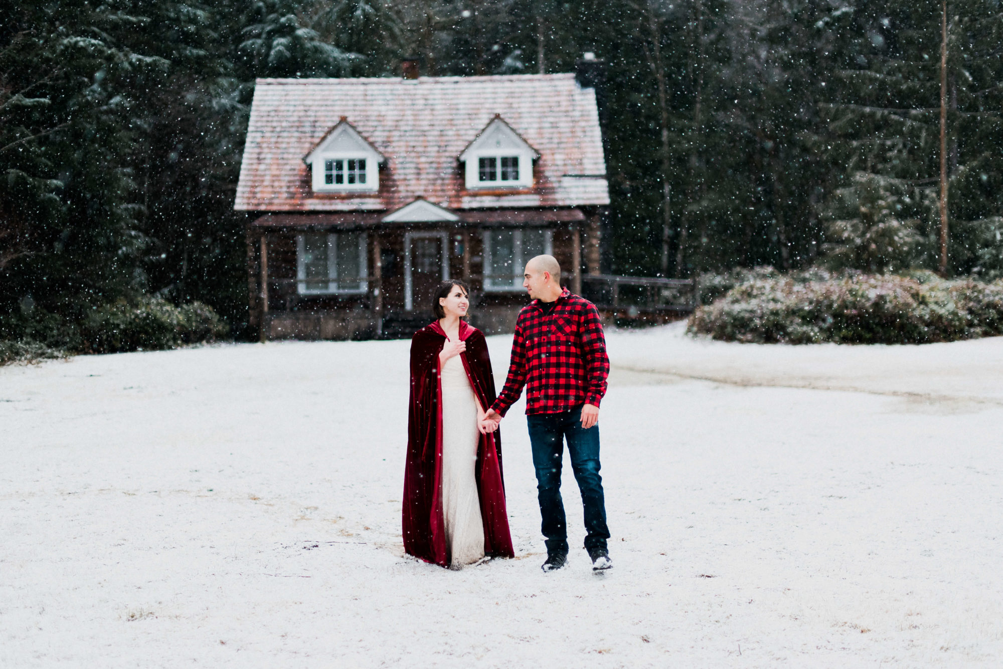 Bride and Groom in the snow at Storm King Ranger Station at Lake Crescent