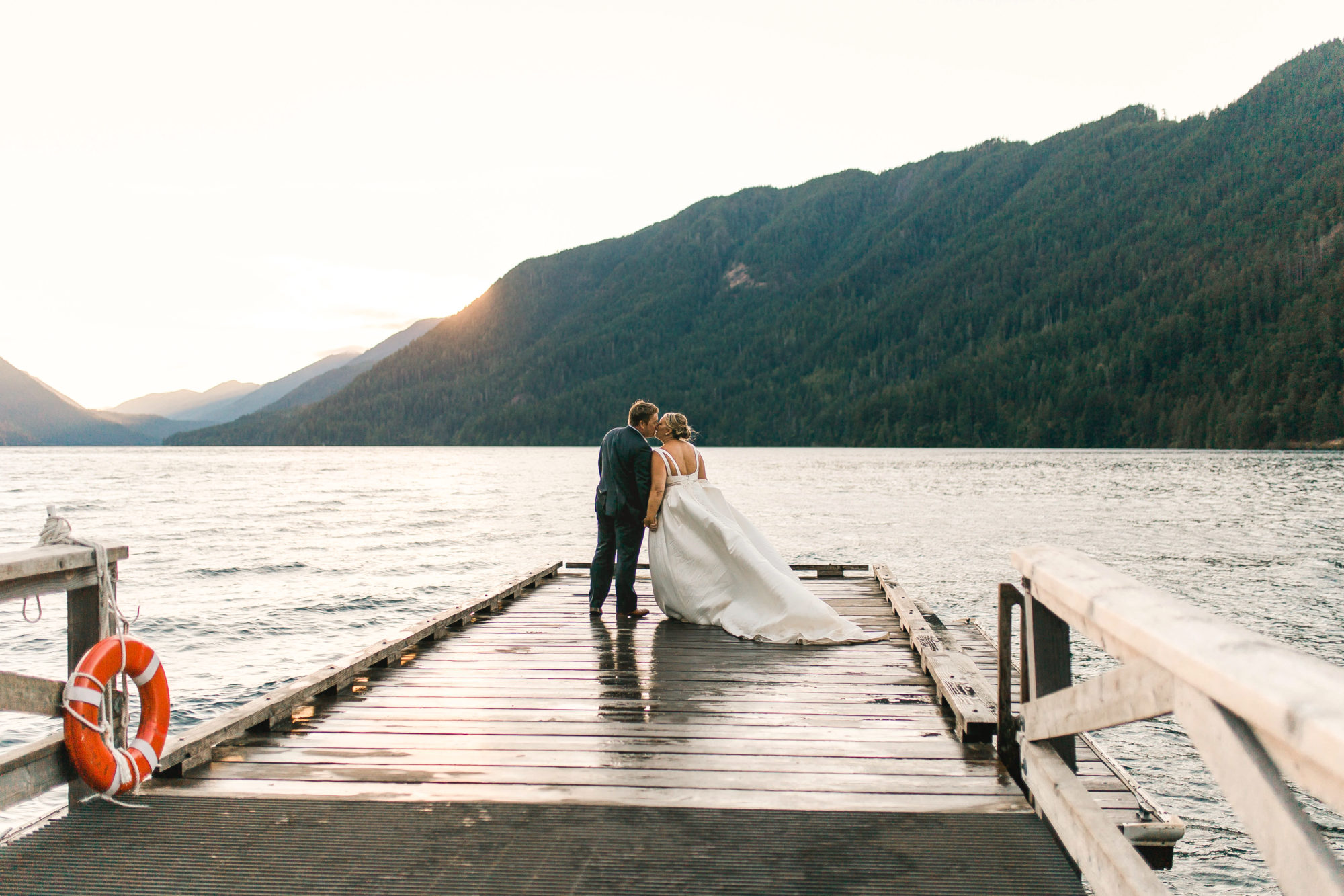 Bride and Groom on a dock at Lake Crescent Lodge wedding