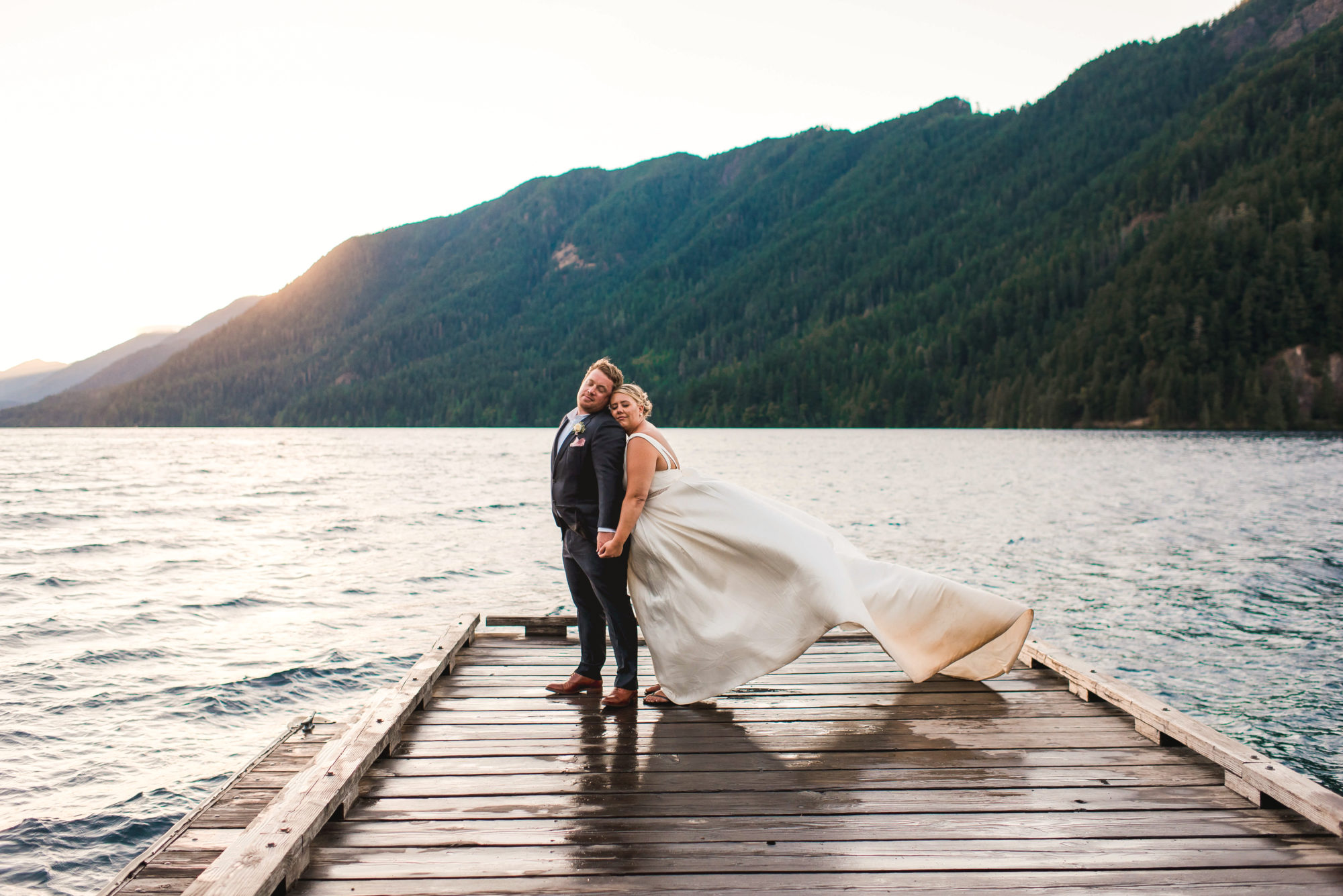 Bride and groom on the dock at sunset at Lake Crescent Lodge