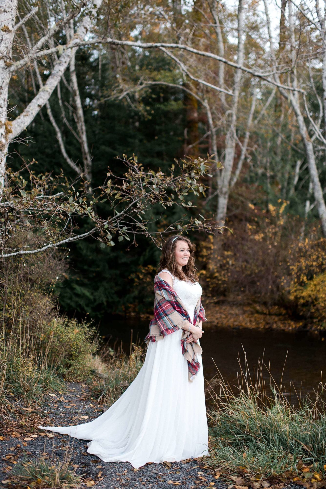 Bride on the beach in the fall at Lake Crescent