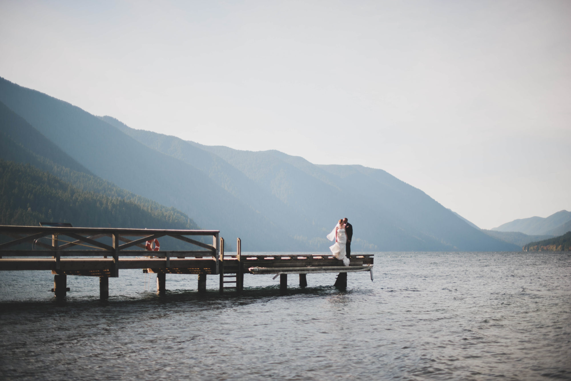Bride and Groom on the dock at Lake Crescent Lodge in Olympic National Park