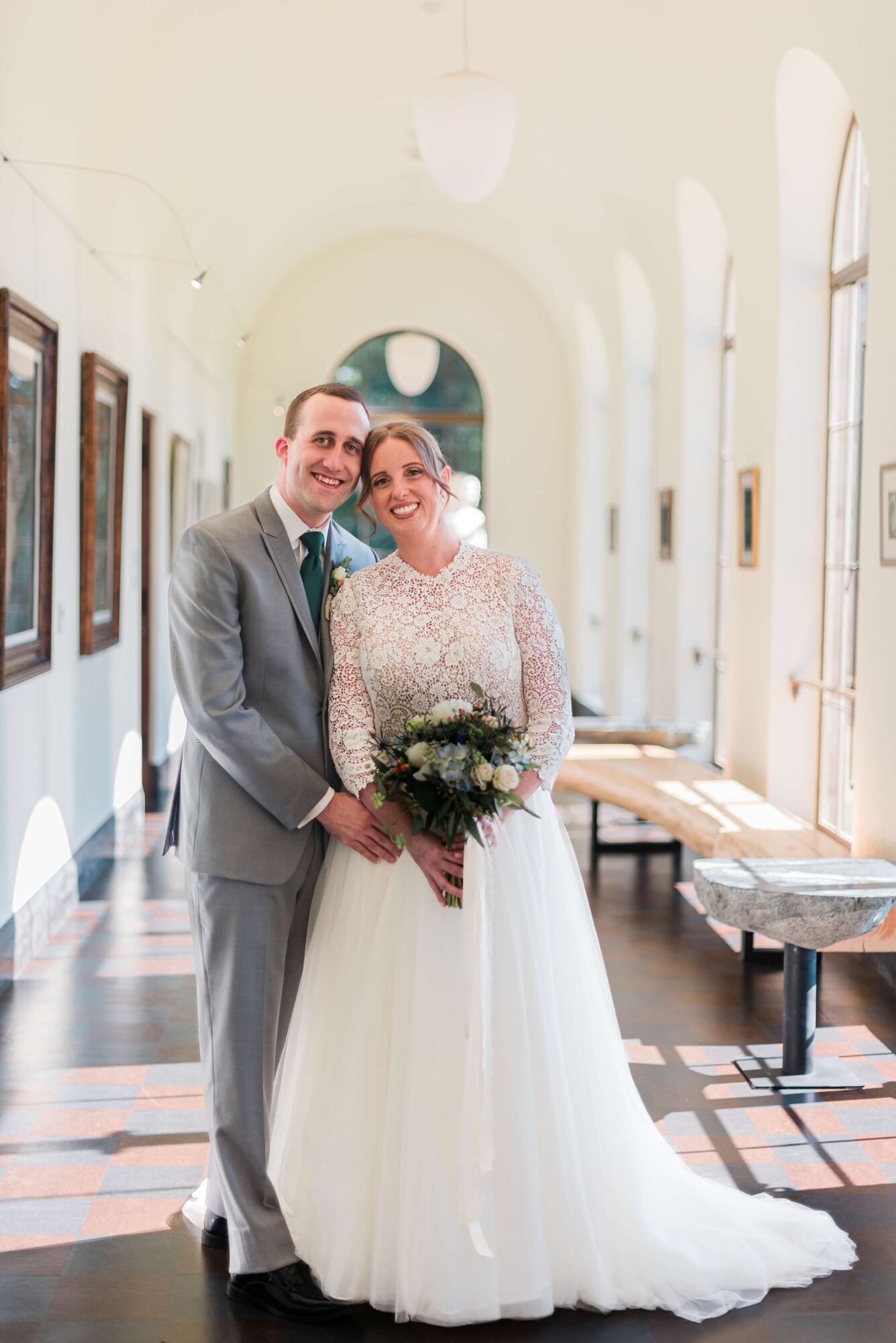 Bride and Groom portraits in the sun-filled art gallery at the Lodge at St. Edward Park wedding