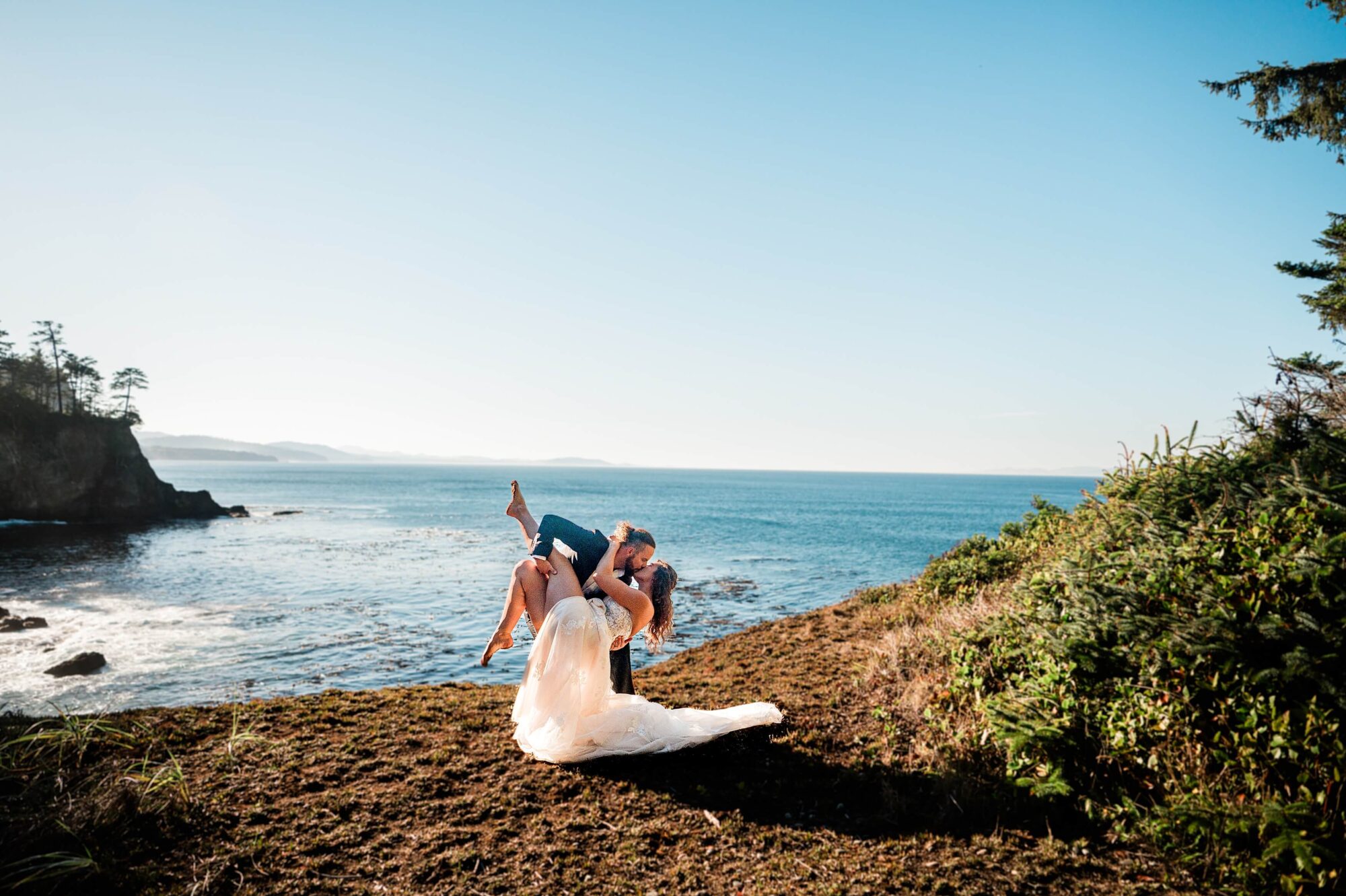 Bride and groom eloping on a cliff in Olympic National Park
