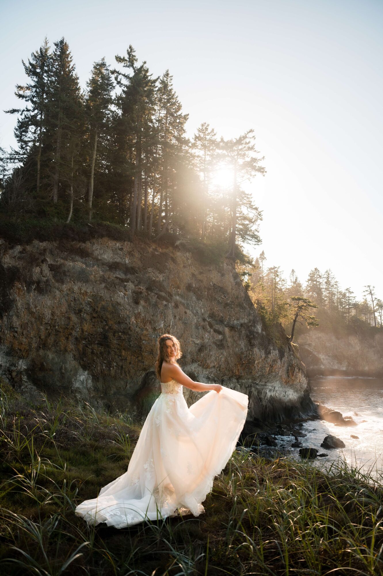 Bride at sunset on a cliff in Olympic National Park