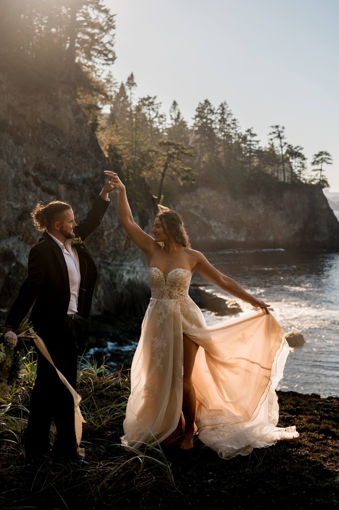 Bride and groom dancing at sunset on the coast of Washington State