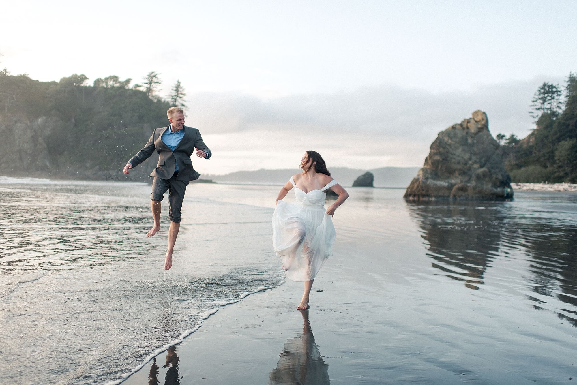 Ruby-Beach-bride and groom jumping