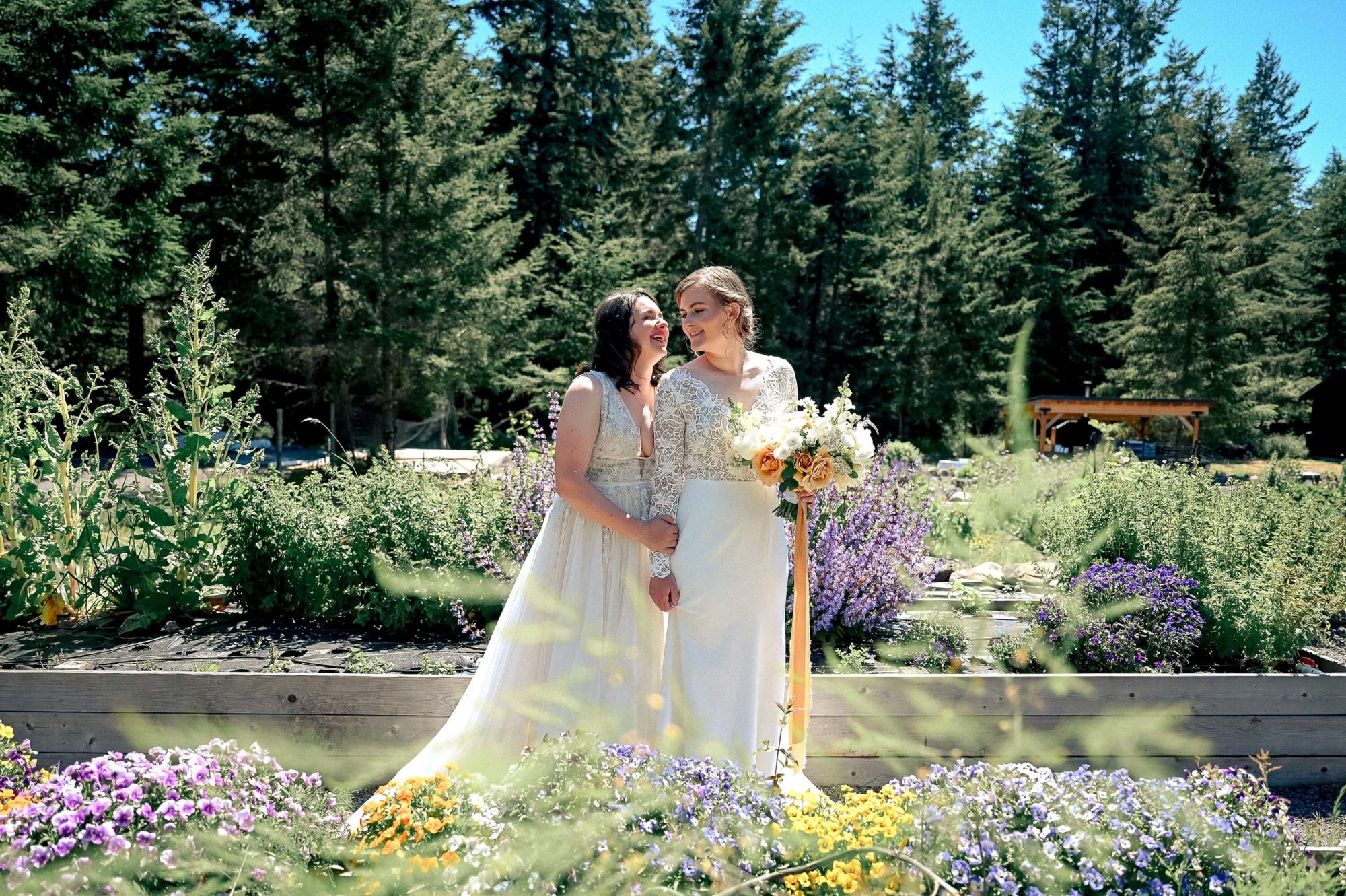 bride holding on to her partner in a wildflower garden at Saltwater Farm Wedding