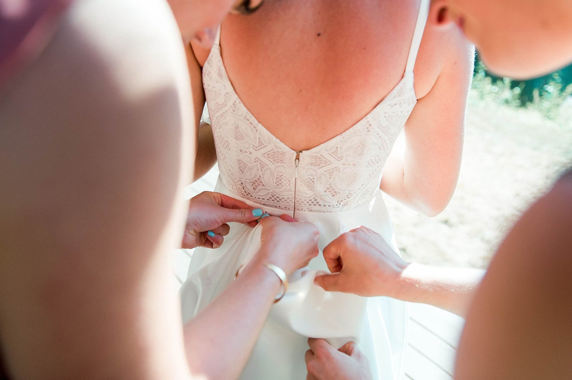 bridesmaids bustling the brides dress at their Lakedale Resort Wedding