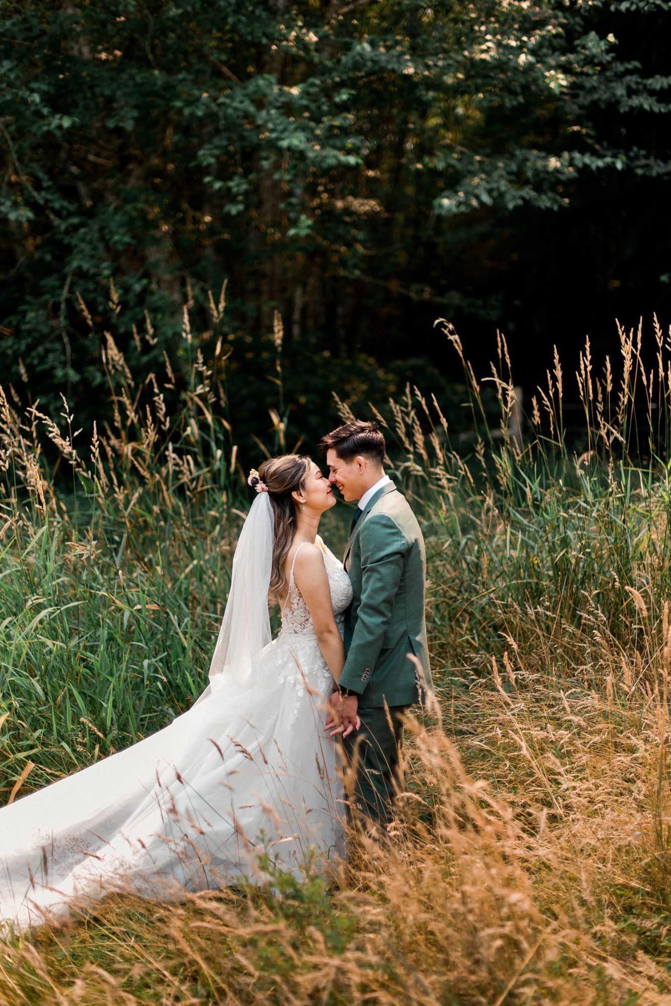Bride and groom in a grassy meadow at a Vashon Island wedding venue