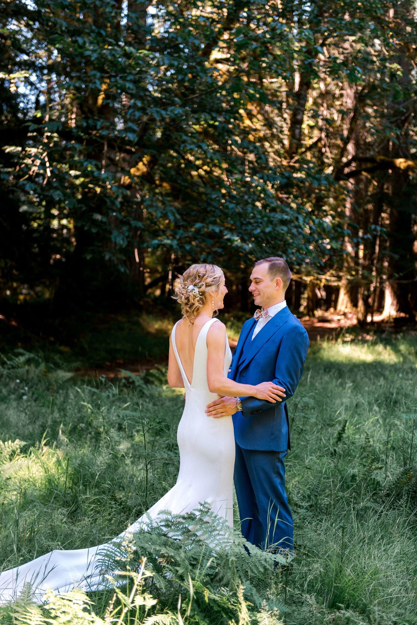 Bride and groom in a forest at a Vashon Island wedding venue