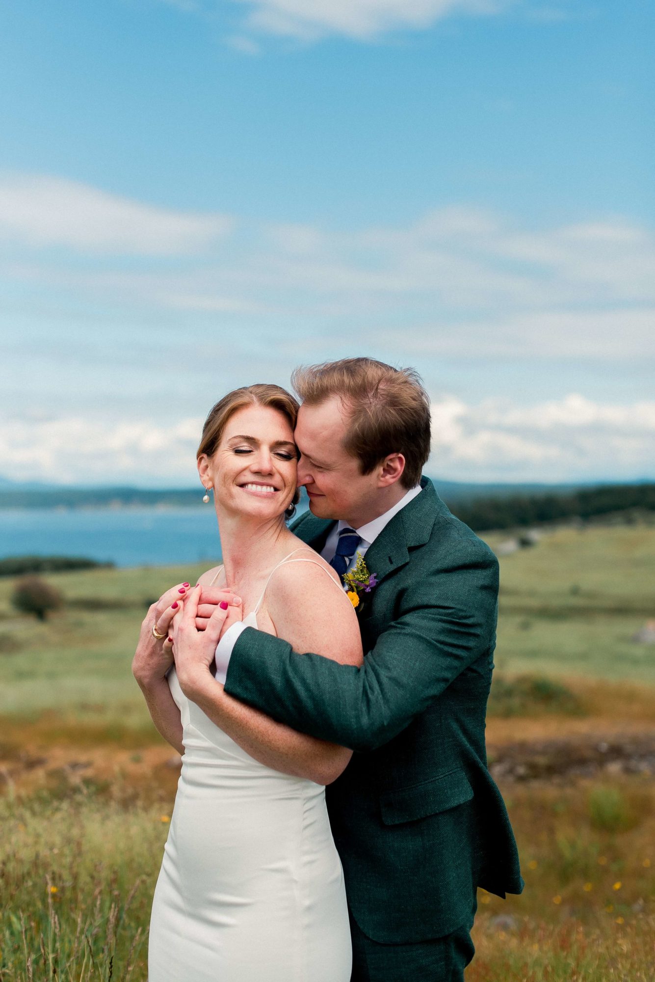 Bride and groom in a meadow on vashon Island
