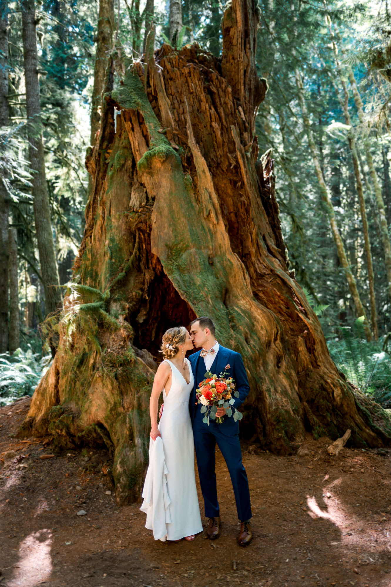 Bride and groom in a forest on vashon Island