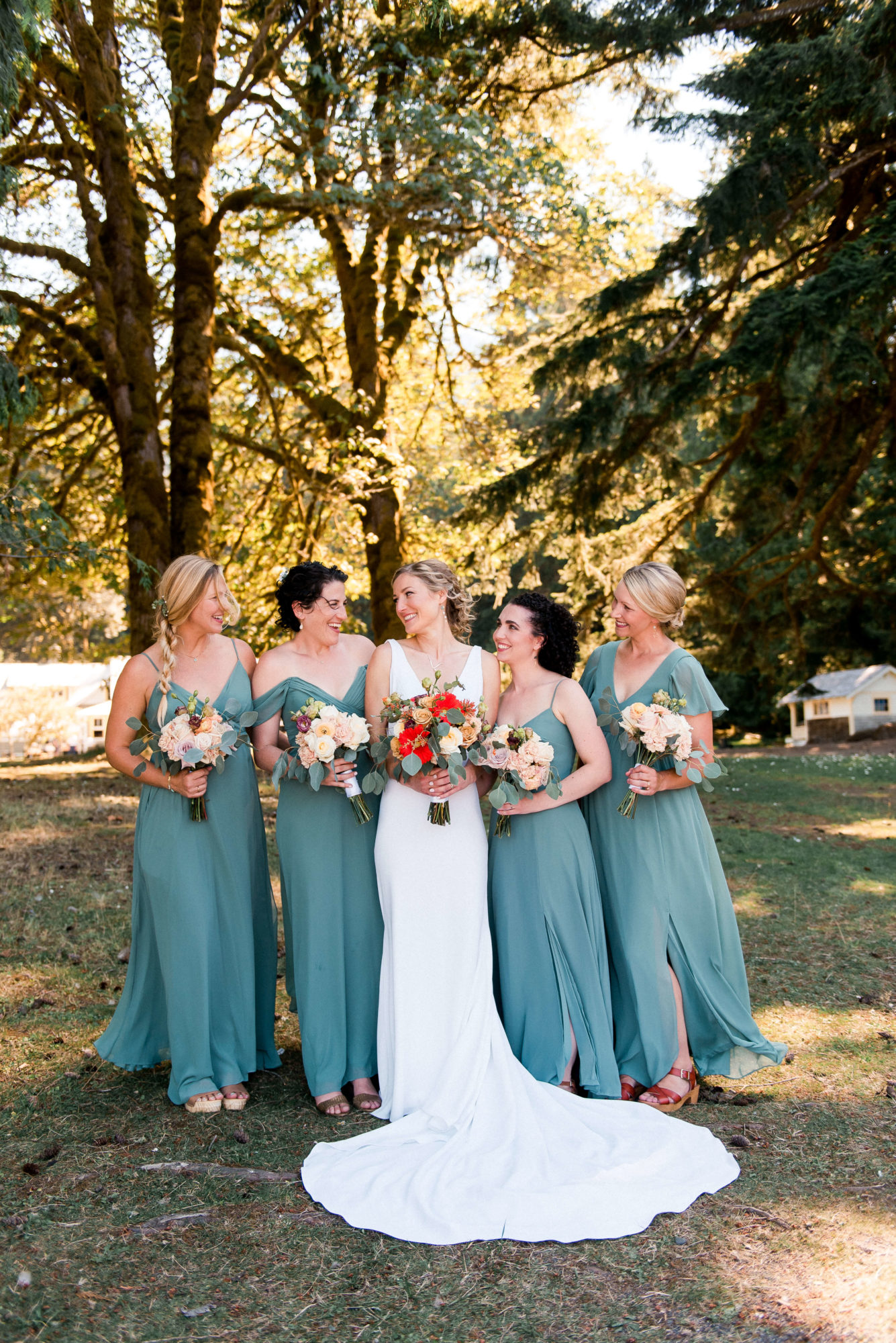 Bride and bridesmaids in a forest on vashon Island