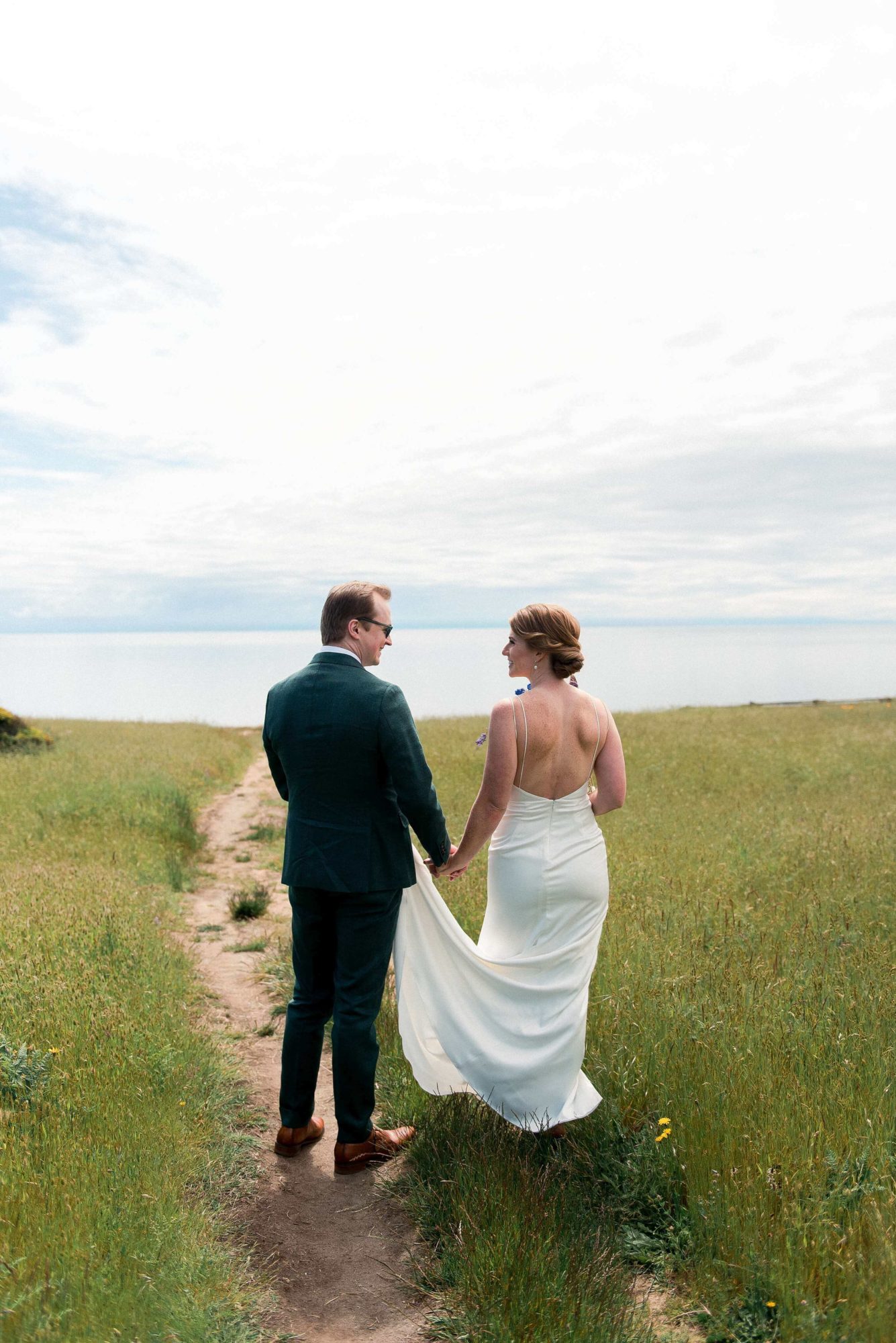 Bride and groom in a meadow on Vashon Island